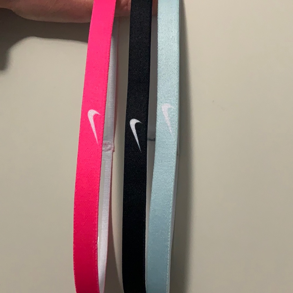 Three Nike headbands - pink, blue and black